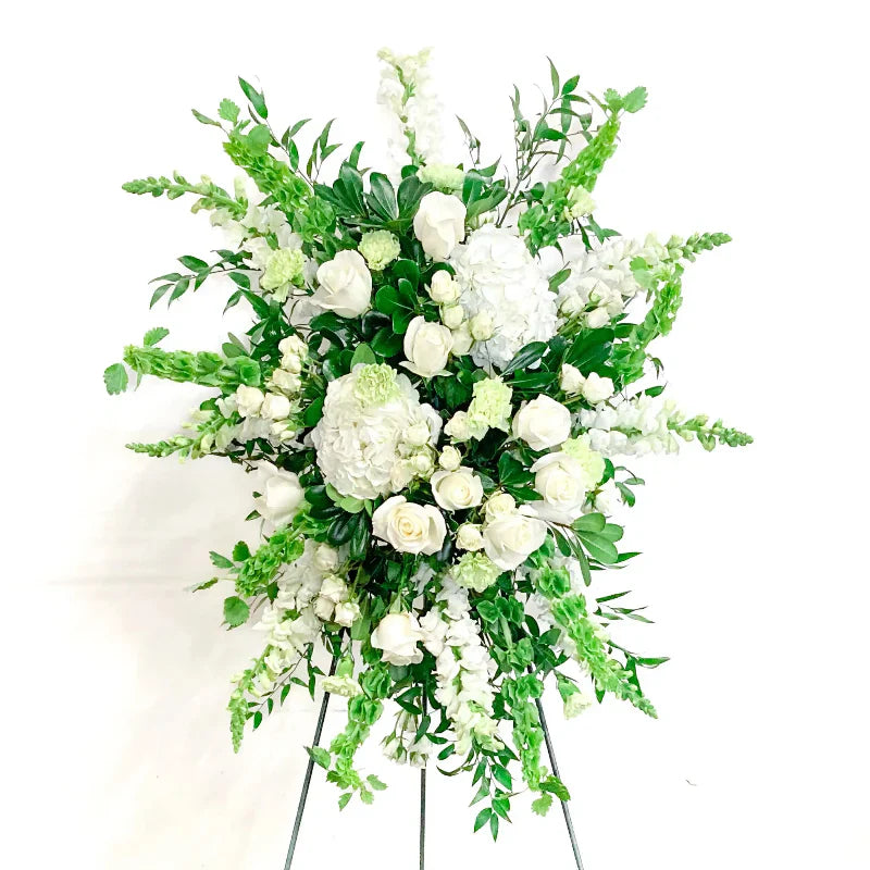 White funeral standing spray with roses and hydrangeas by Richardson florist Lizzie Bee's Flower Shoppe