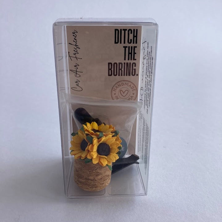 Car Vent Clip Air Freshener Diffuser with cork bottom and sunflower top in packaging