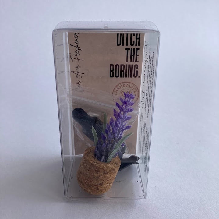 Car Vent Clip Air Freshener Diffuser with cork bottom and lavender top in packaging
