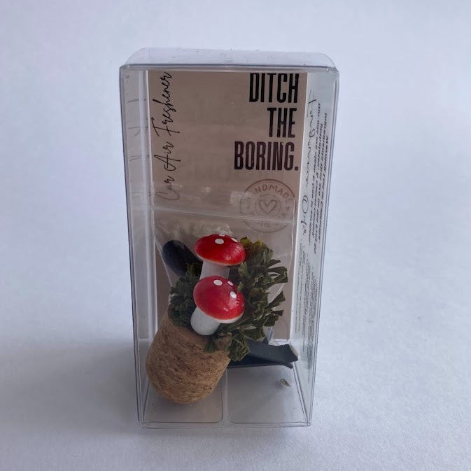 Car Vent Clip Air Freshener Diffuser with cork bottom and mushroom top in packaging