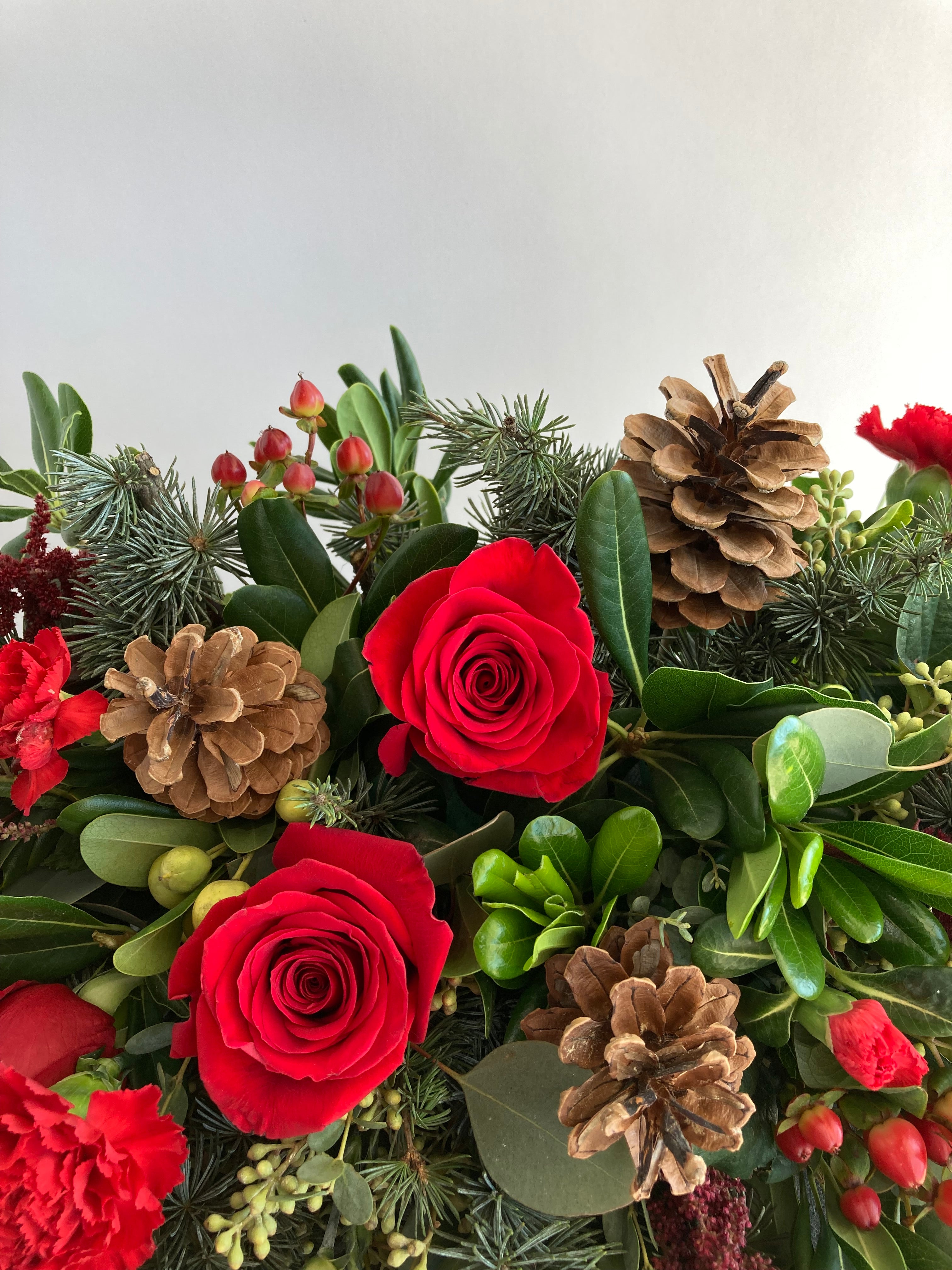 Home For The Holidays Centerpiece | Winter Seasonal Florist Design in Red Tones + Christmas Greens