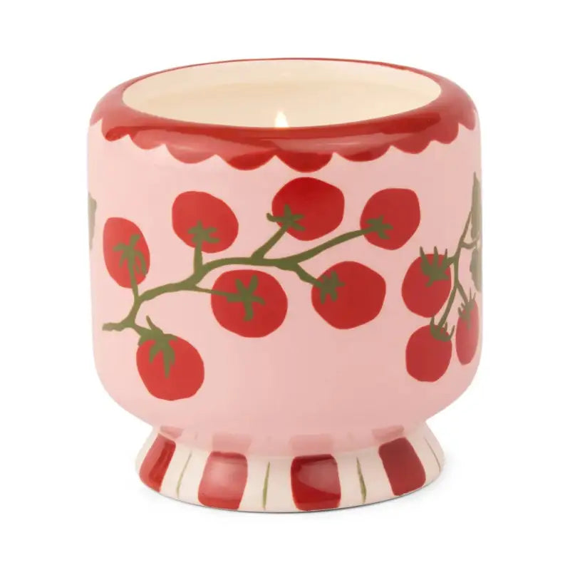 Ceramic container with tomato design on a white background