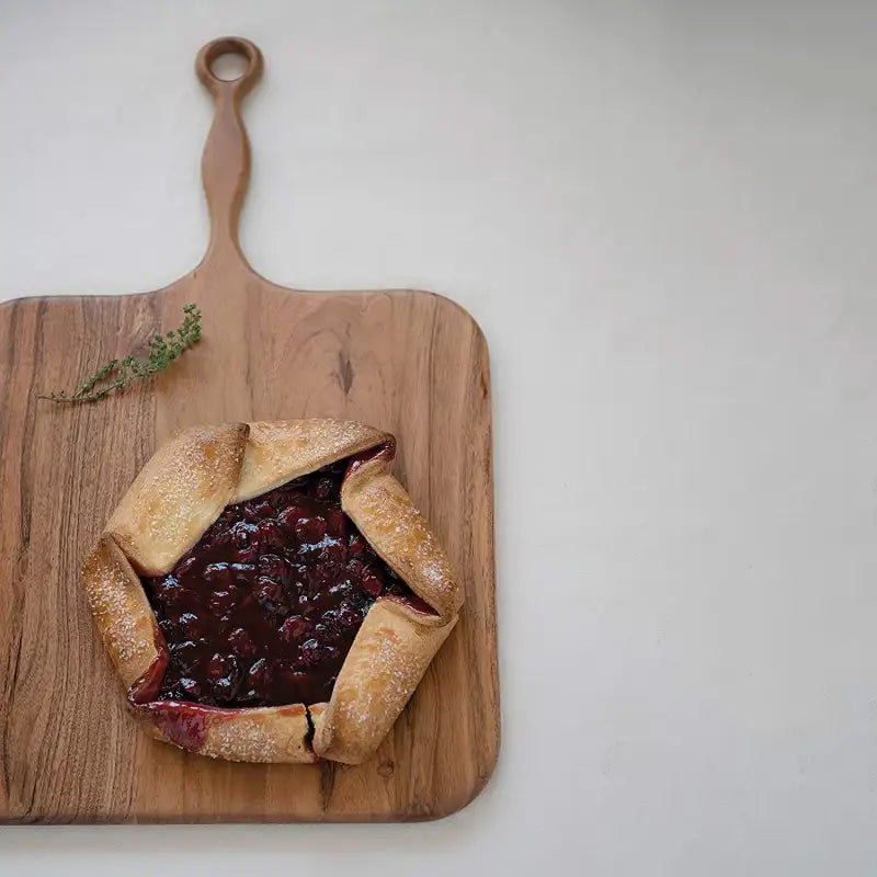  galette with berry filling on a wooden board
