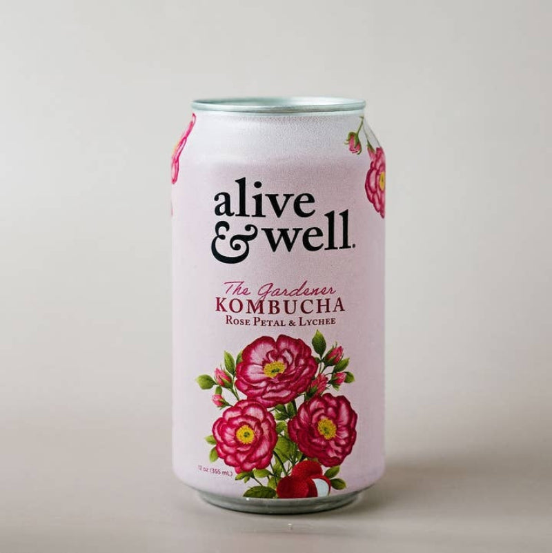 A 12 fl oz aluminum can of 'alive & well.' Kombucha, Rose Petal and Lychee flavor, featuring a white background decorated with pink roses and green leaves.