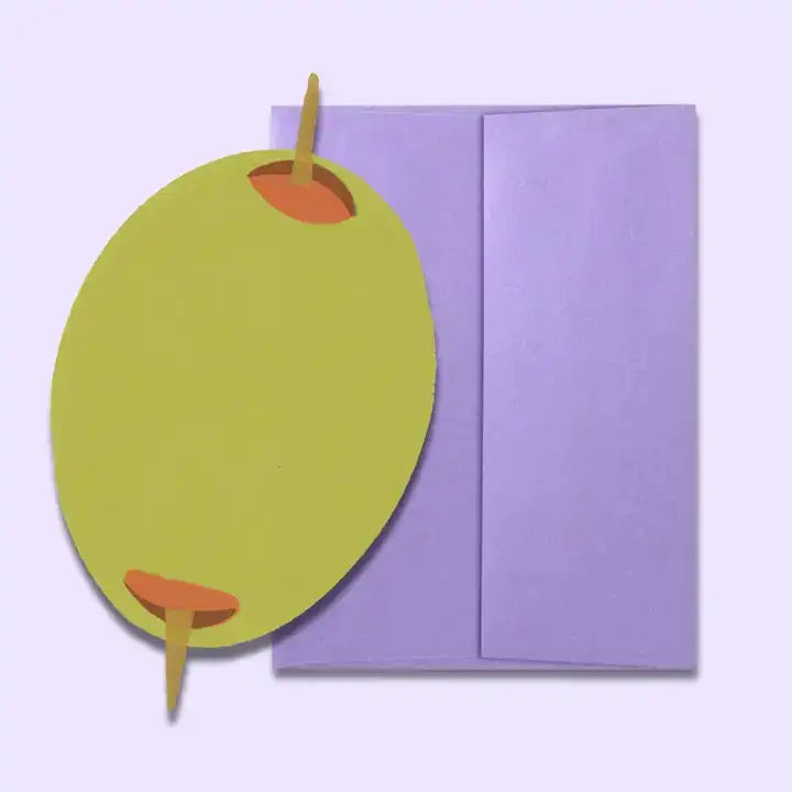 Green apple-shaped card with red stem on a purple envelope against a light purple background