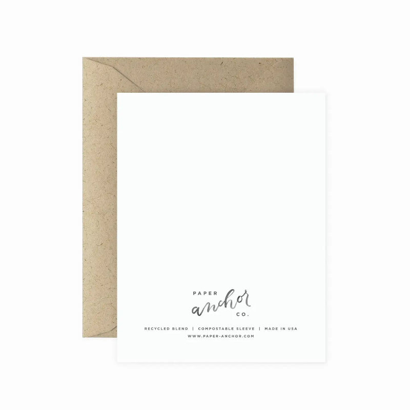 Kraft paper envelope with white card and 'Paper Anchor Co.' branding