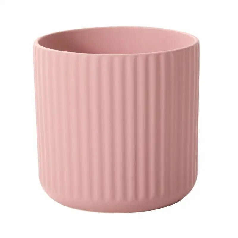 Pink textured cup on a white background