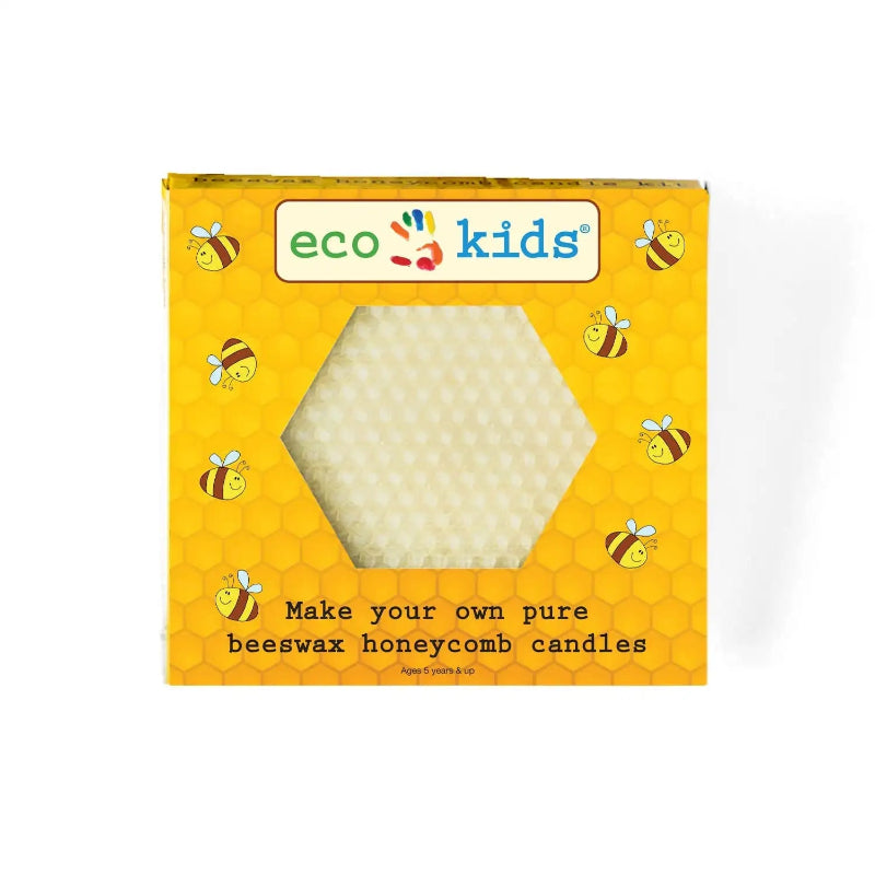 A square yellow box of eco kids Beeswax Honeycomb candles, featuring a hexagonal cutout window that reveals the white honeycomb wax inside. The packaging is decorated with cartoon bees and a honeycomb pattern, with the 'eco kids' brand logo at the top.