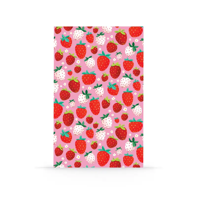 Notebook with strawberry pattern on a pink background
