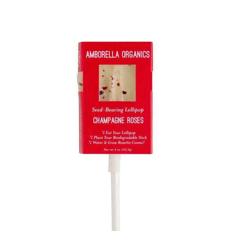 Red lollipop packaging with 'Amborella Organics' branding on a white background
