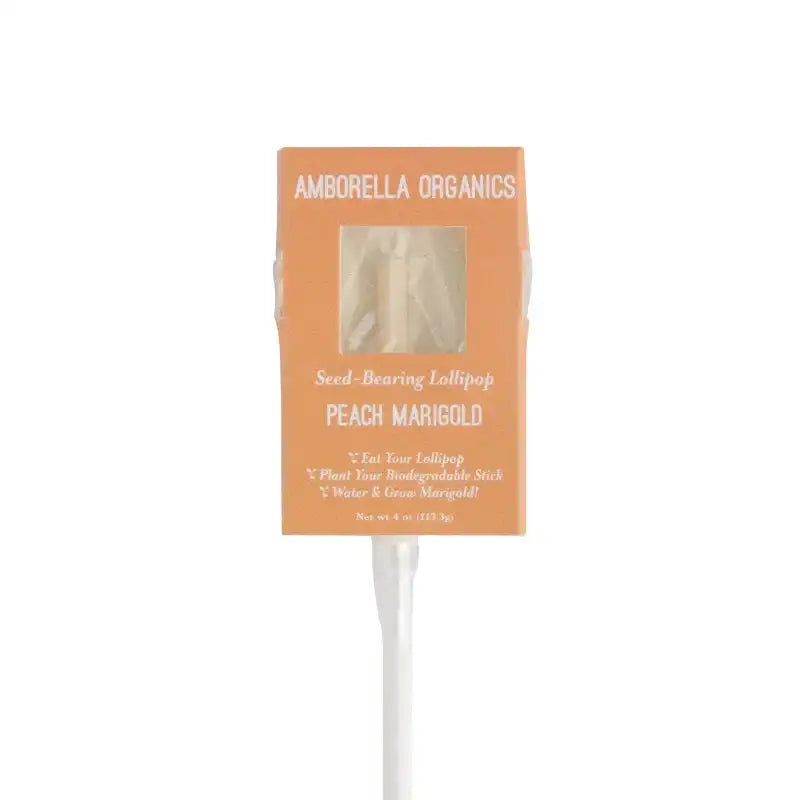 Amborella Organics peach marigold seed-bearing lollipop packaging on a white background