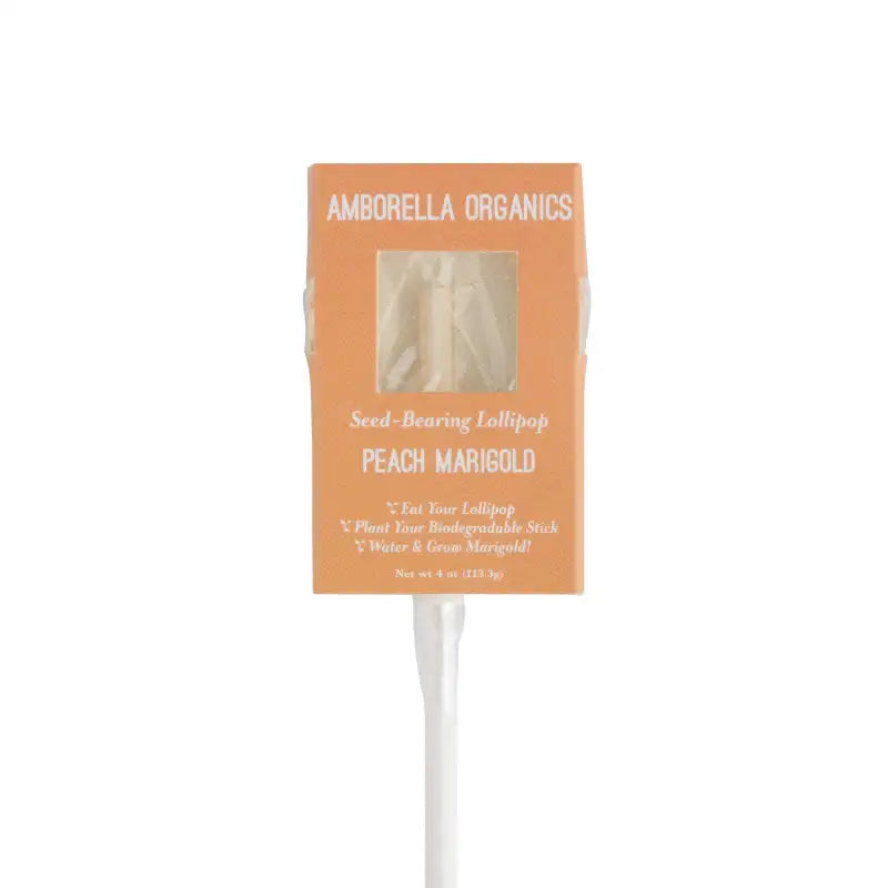 Amborella Organics peach marigold seed-bearing lollipop in packaging on a white background