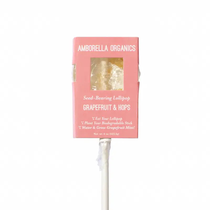 Seed-bearing lollipop with pink packaging labeled 'Amborella Organics' on a white background