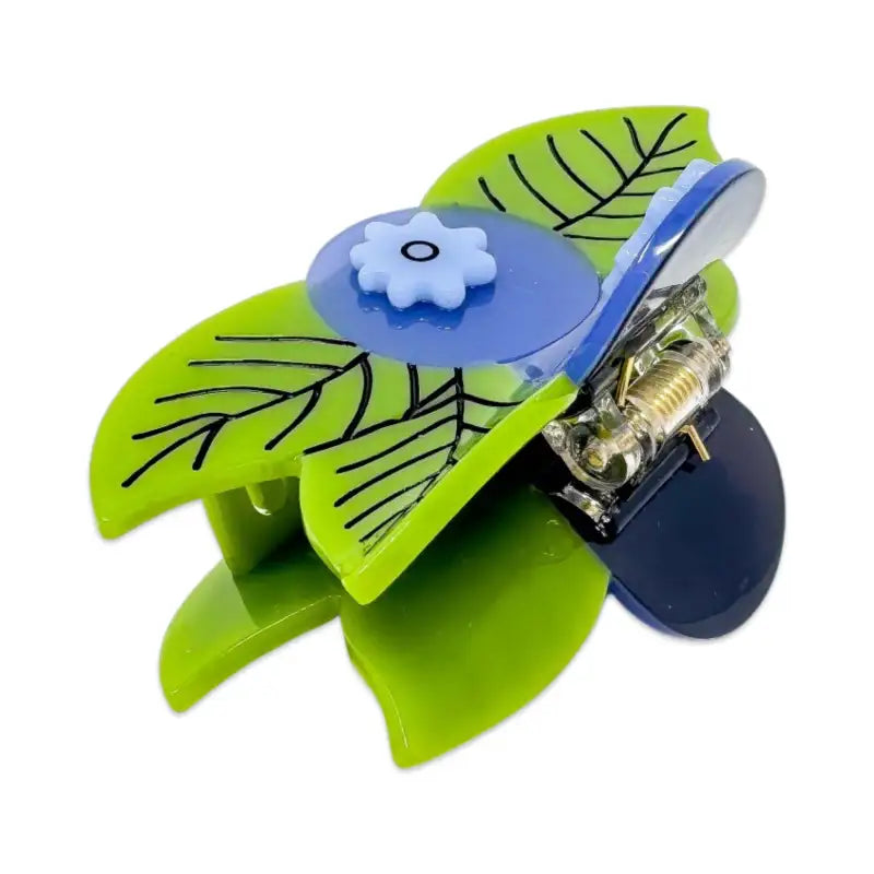 A blueberry hair claw on a white background