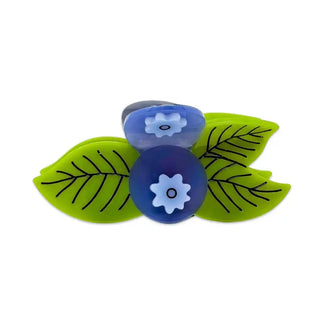 A blueberry hair claw on a white background