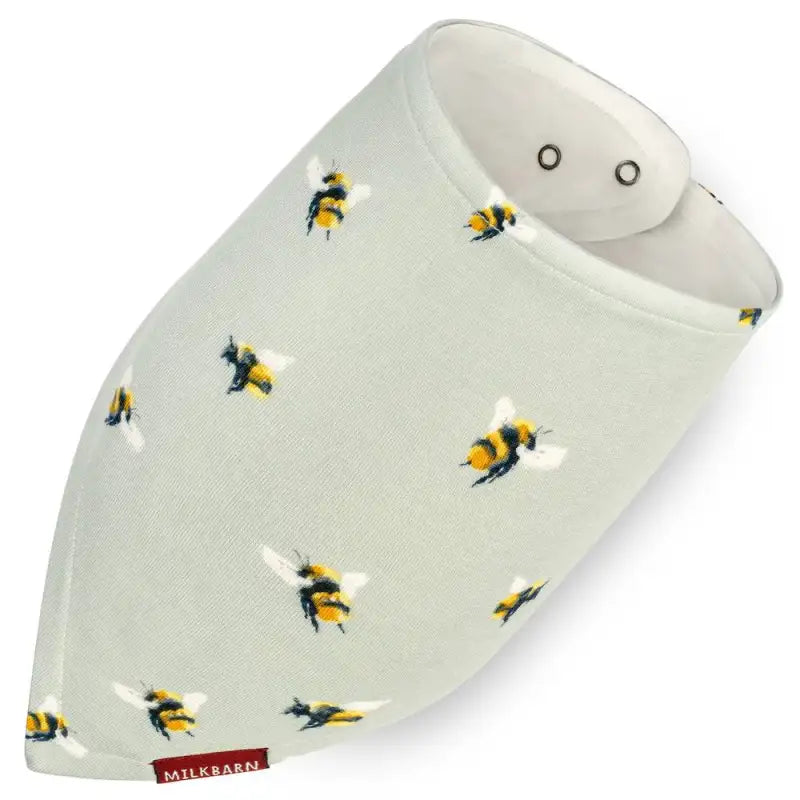 Baby bib with bee pattern and 'Milkbarn' branding on a white background