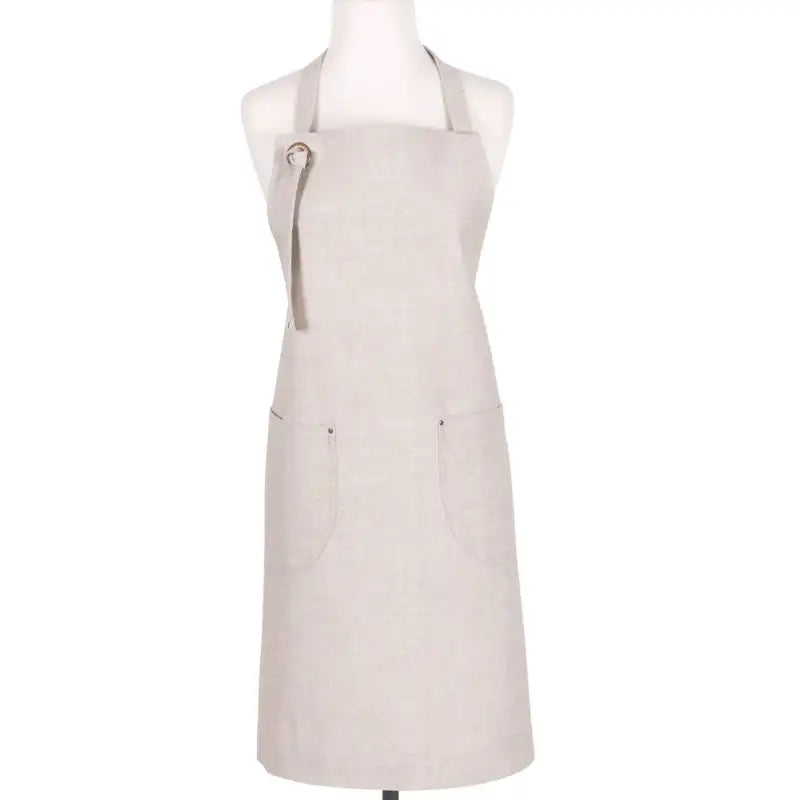 Beige apron on a mannequin against a white background