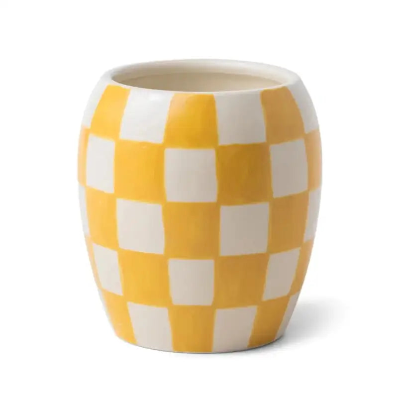 Ceramic vase with yellow and white checkered pattern on a white background
