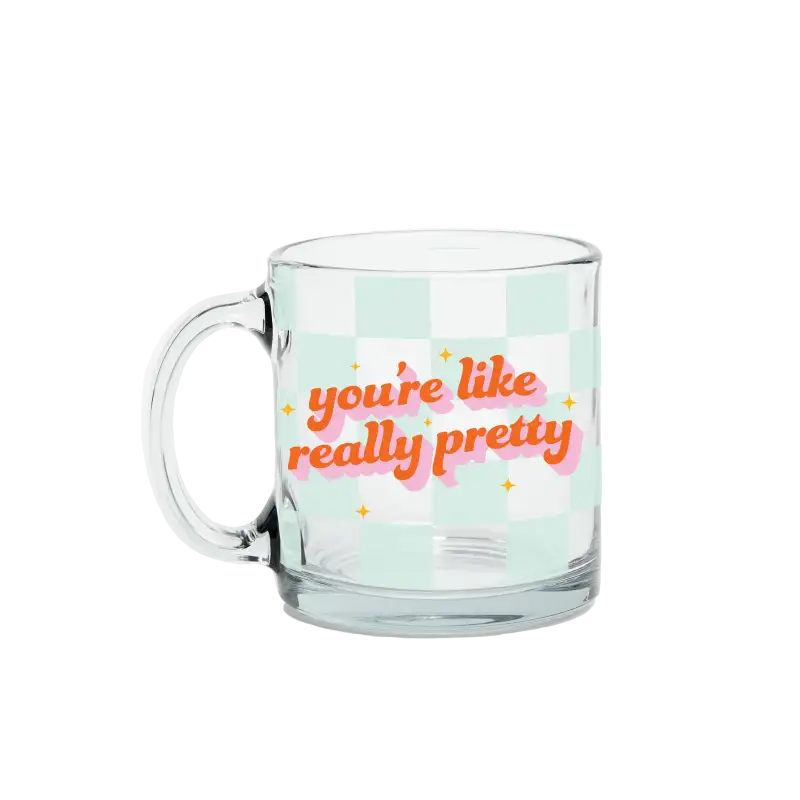 Clear mug with text 'you're like really pretty' on a light green checkered background
