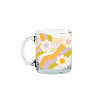 Clear glass mug with floral design on a white background