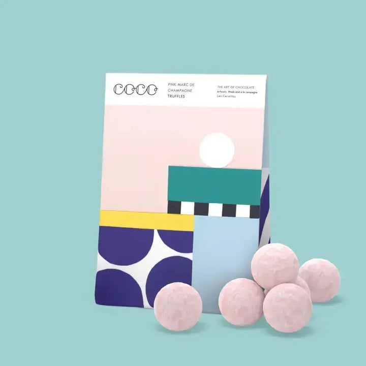 Colorful packaging of truffles on a light blue background