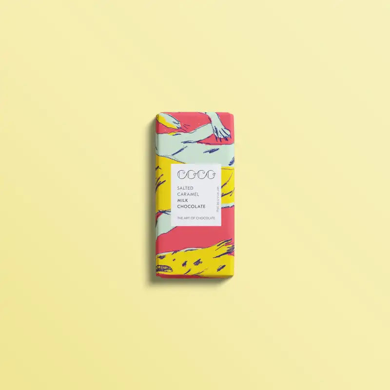 Chocolate bar with colorful packaging on a light yellow background