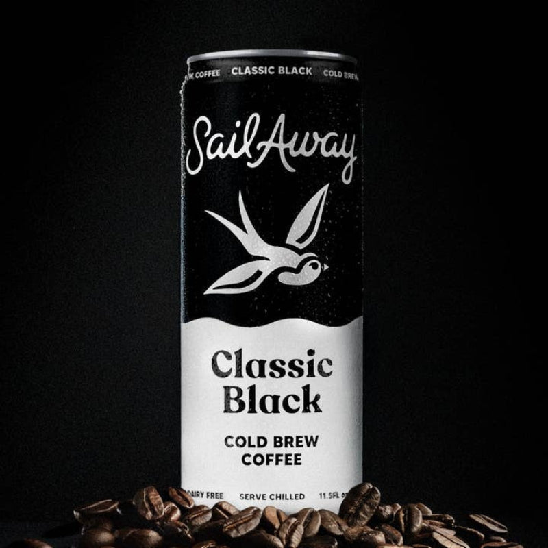 A tall can of SailAway Classic Black cold brew coffee, shown upright on a dark background with scattered coffee beans at the base. The can is black and white with the SailAway logo and product name clearly visible.