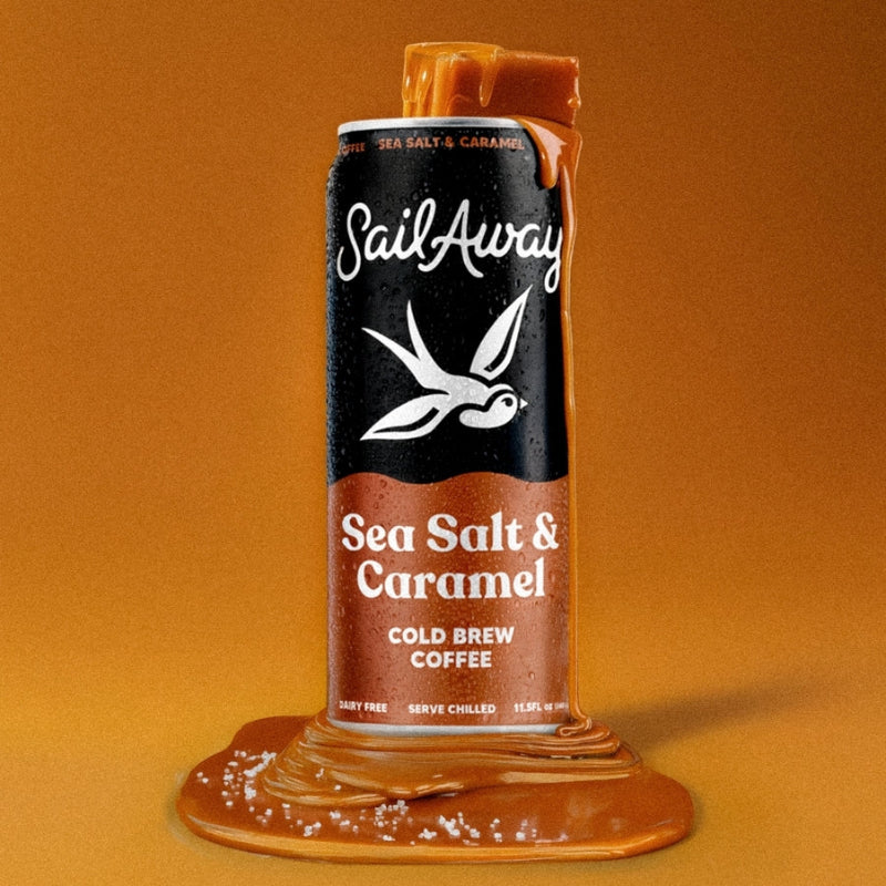 A single can of SailAway Sea Salt & Caramel cold brew coffee stands upright on a matching brown background, with caramel-like syrup dripping from the top and pooling around the base. The can label is black and warm caramel brown with white text and a white bird logo.