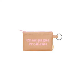 Small beige pouch with 'Champagne Problems' text on a white background