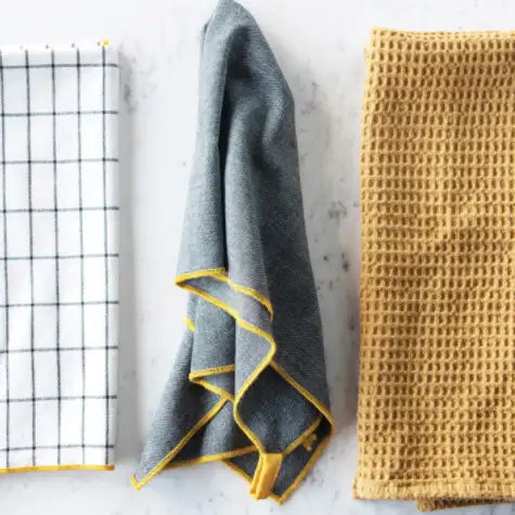 Four different textured towels on a light background