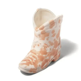 Pink and white patterned shoe on a white background