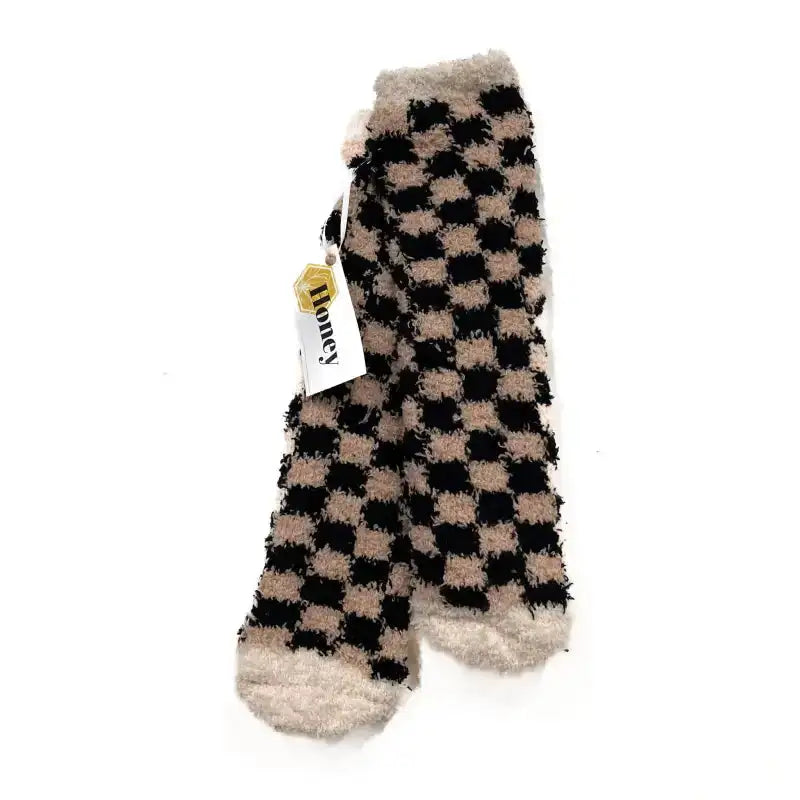 Checkered socks with a brand tag on a white background