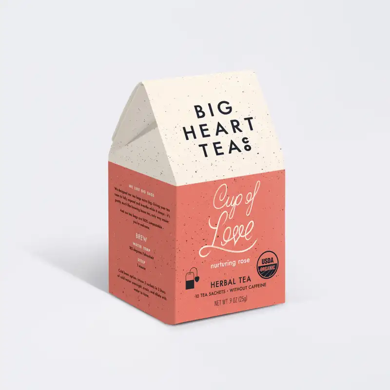 Big Heart Teas 'Cup of Love' herbal tea packaging on a light gray background