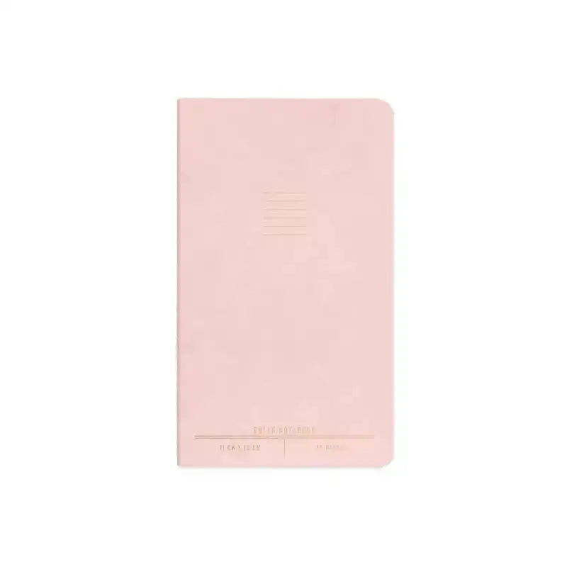 Pink notebook with gold text on a white background