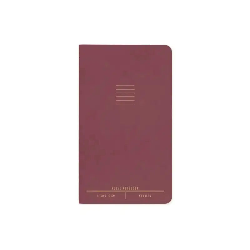 Maroon notebook with grid pattern on a white background