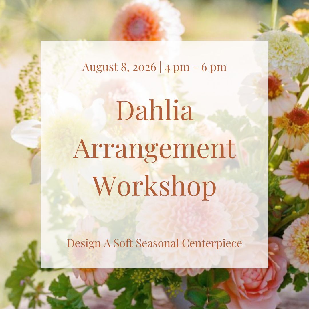 Seasonal dahlia floral arrangement in coral, peach, white, and yellow tones designed in a soft romantic summer style