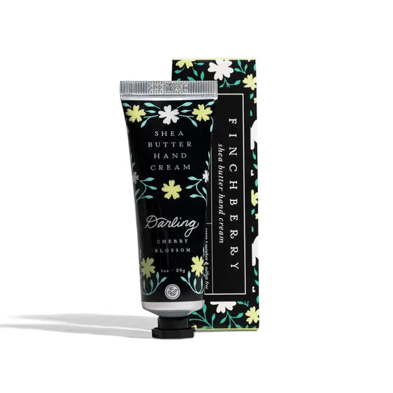 Hand cream with floral packaging on a white background