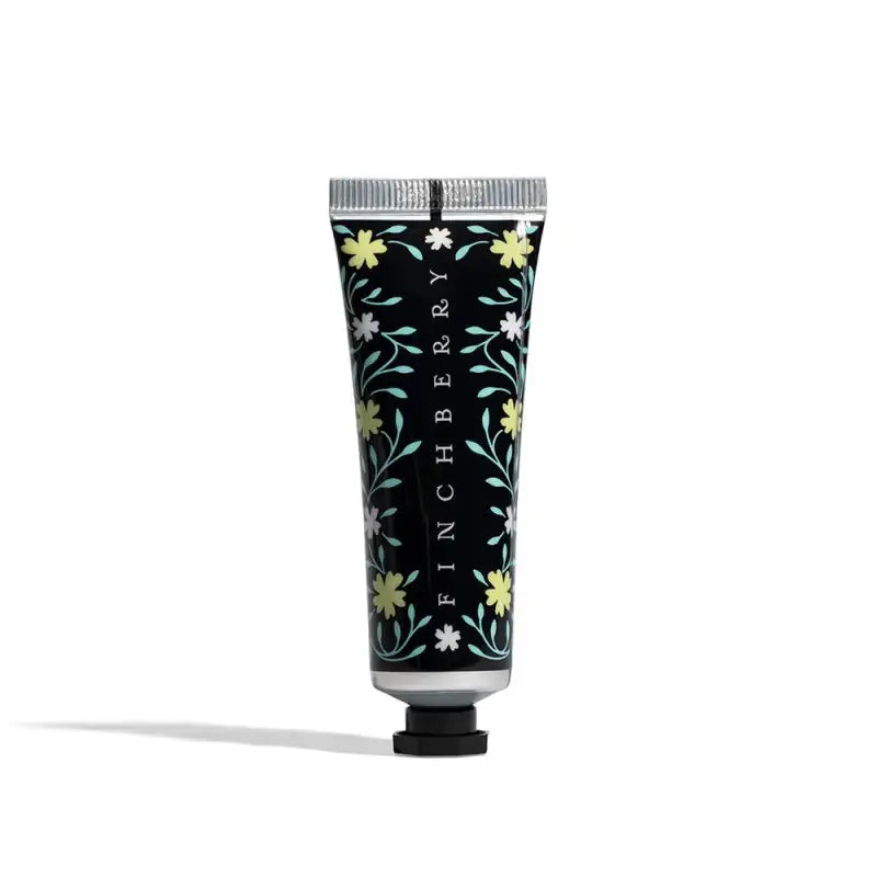 Hand cream tube with floral design and 'Finchberry' branding on a white background