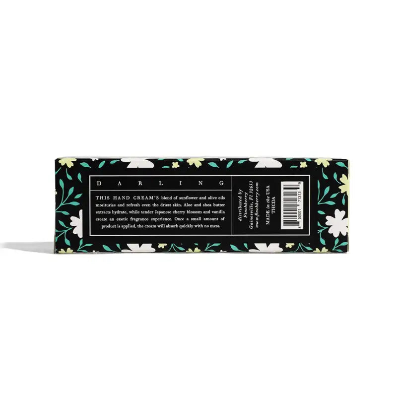 Hand cream packaging with floral design on a white background