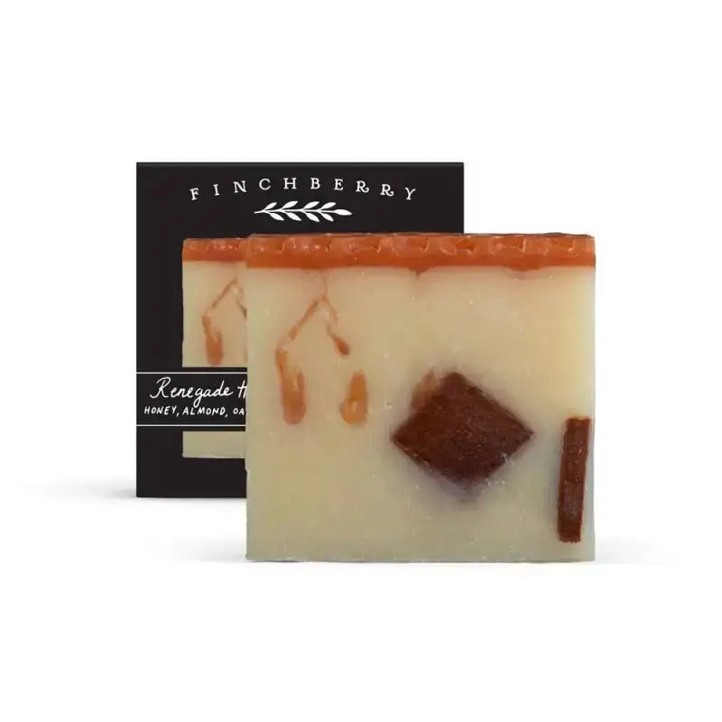Two bars of Finchberry soap with visible ingredients on a white background