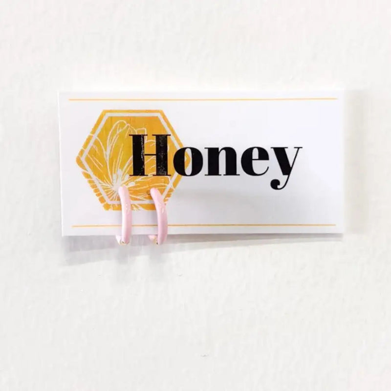 Honeycomb-shaped product with 'Honey' text on a white background