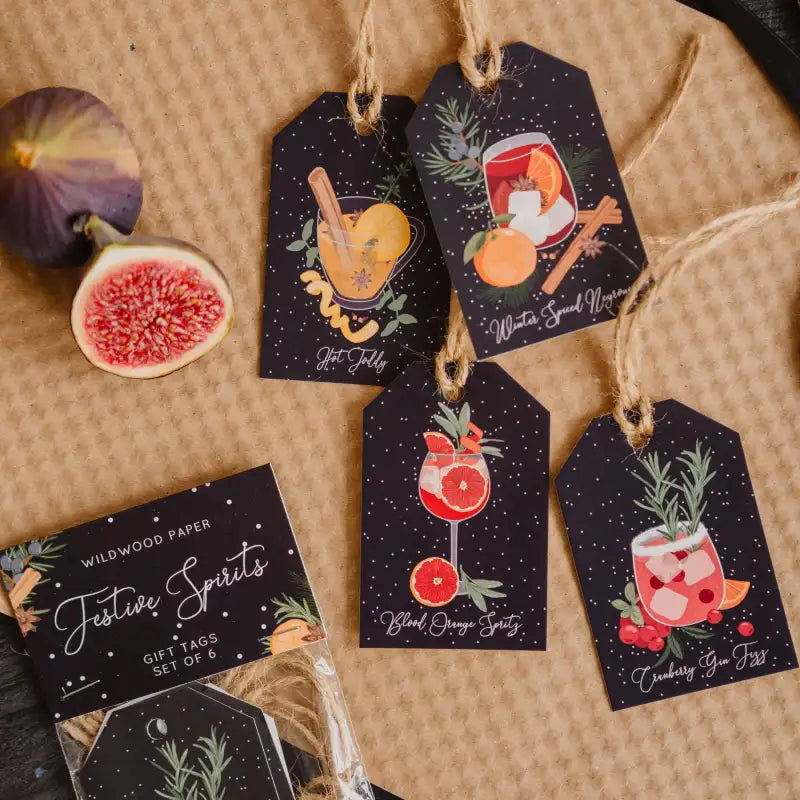 Set of gift tags with festive designs on a textured surface