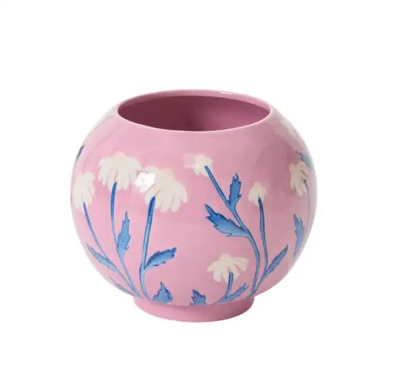 Pink ceramic vase with floral patterns on a white background