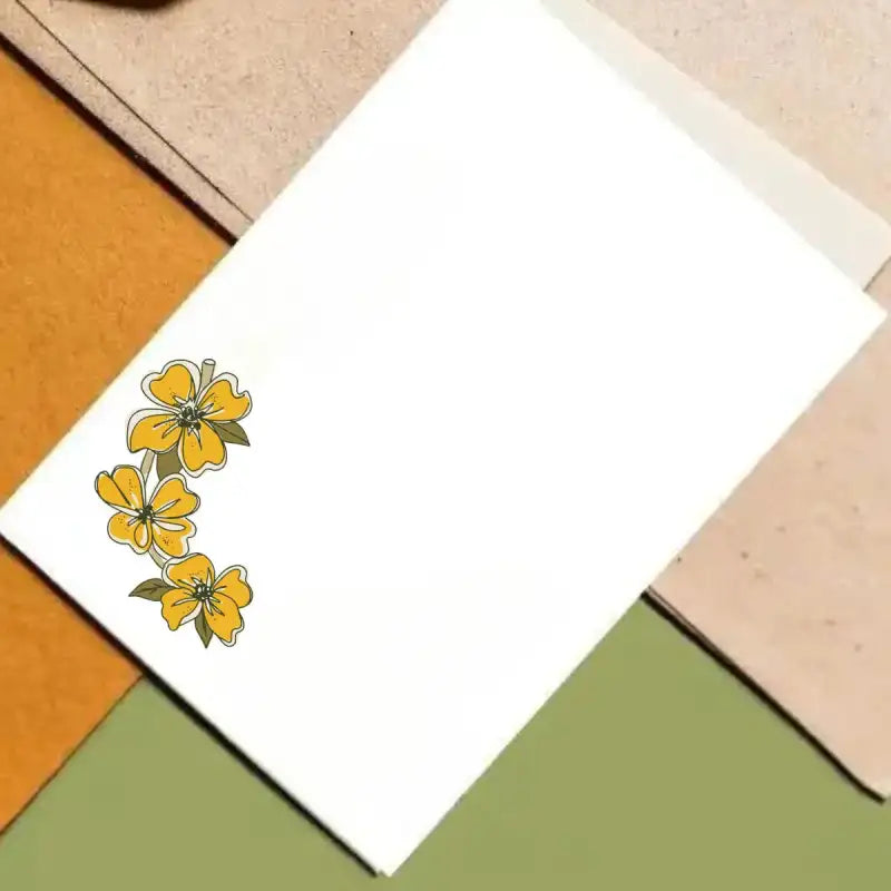 White card with yellow floral design on a multicolored geometric background