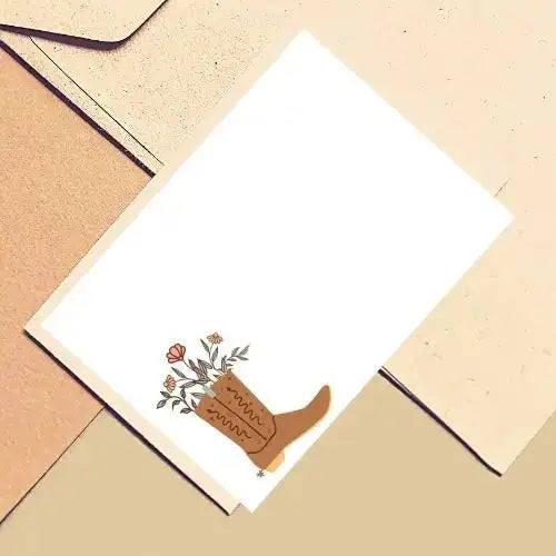 Notebook with a floral design on a beige surface