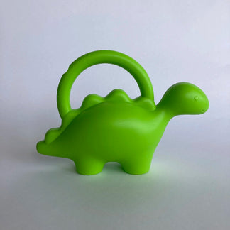Green dinosaur-shaped watering can on a white background