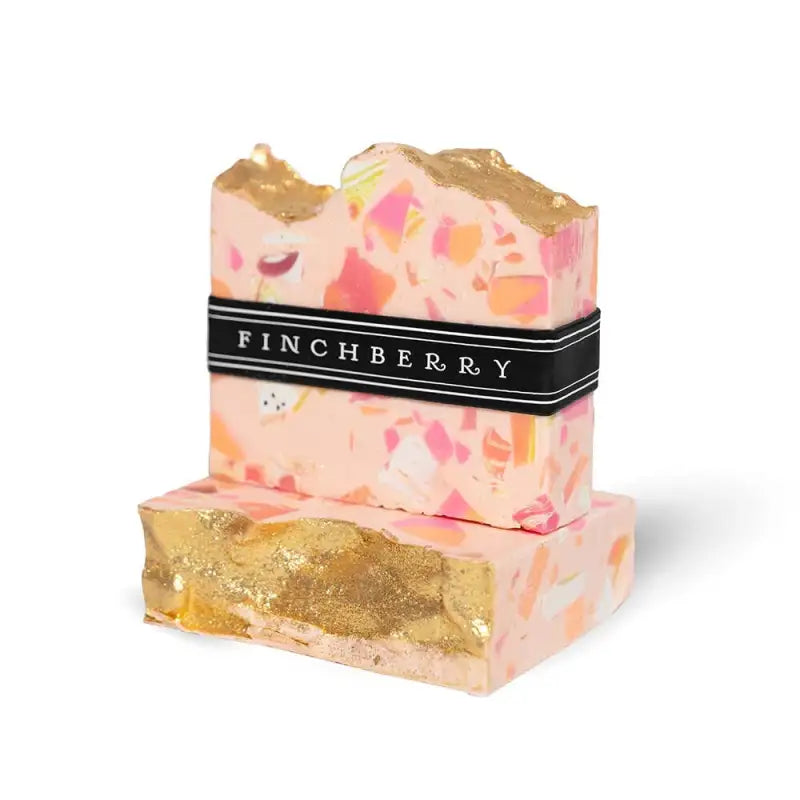 Two floral soap bars with gold accents and a Finchberry label on a white background