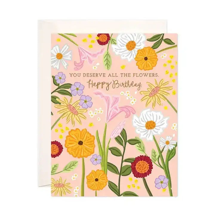 Floral birthday card with colorful flowers on a pink background