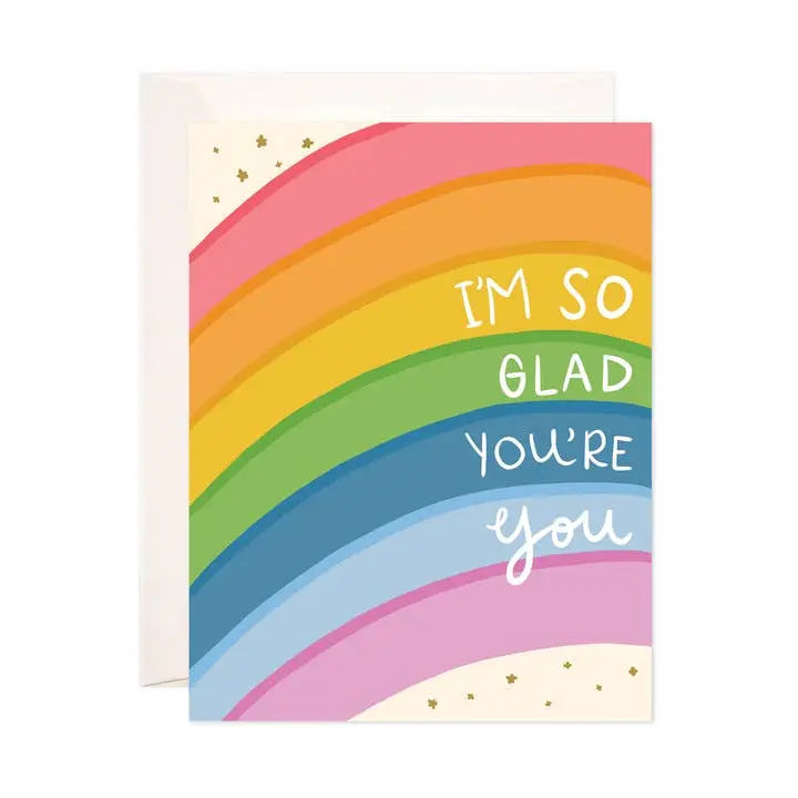 Greeting card with rainbow design and text 'I'm so glad you're you' on a white background