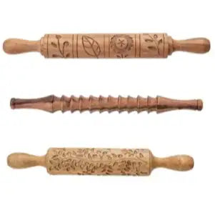 Three wooden rolling pins with engraved designs on a white background